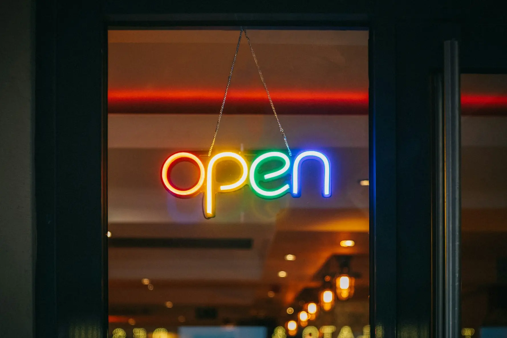 red and white open neon signage